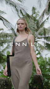 Model walking along beach wearing Jenn Lee Mocca Side Slit Knit Dress and carrying Jenn Lee Nayarit Tote