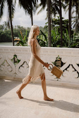 Model wearing Jenn Lee Sand Fringe Knit Dress and Jenn Lee Positano Box Bag