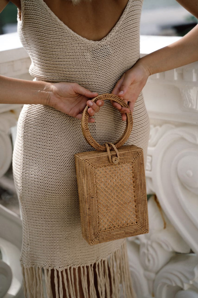 Model wearing Jenn Lee Sand Fringe Knit Dress and Jenn Lee Positano Box Bag